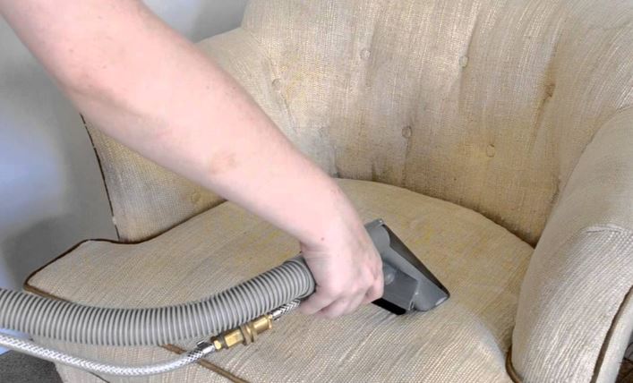 applying the steam upholstery cleaning process